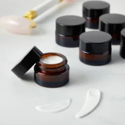 Juvale 24 Pack 5ml Amber Glass Cosmetic Jars With Lids And 6 Spatulas For Beauty Products, Samples, Lip Balm, 1.4x1 In